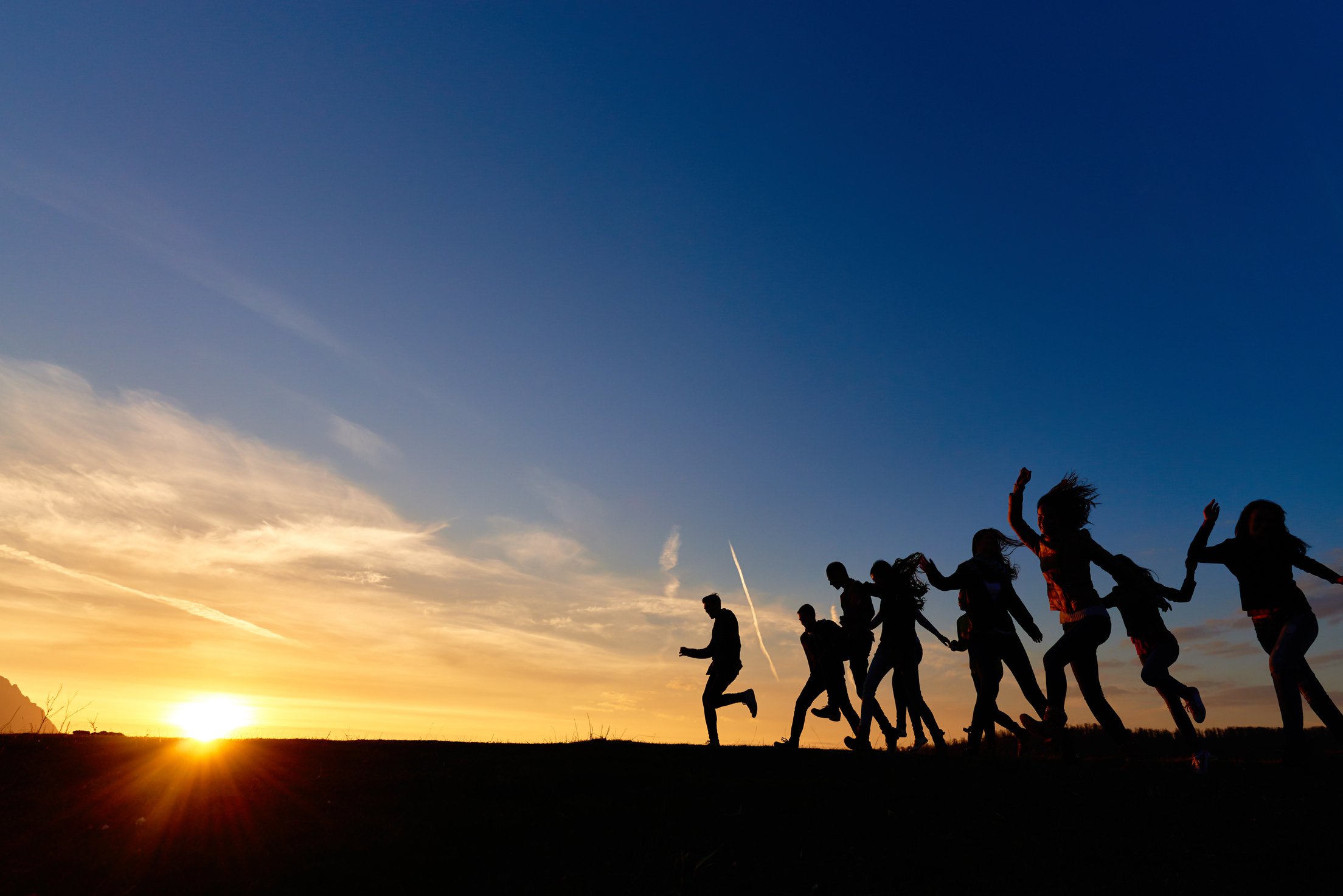 dancing and running friends at sunset